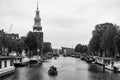 AMSTERDAM, NETHERLANDS. JUNE 06, 2021. Beautiful view of Amsterdam with typical dutch houses, bridges and chanel. Black and white