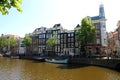 AMSTERDAM, NETHERLANDS - JUNE 6, 2018: channel in Amsterdam with houses on river Amstel landmark old european city spring Royalty Free Stock Photo