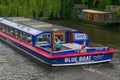 AMSTERDAM, NETHERLANDS - JUNE 25, 2017: Tourist cruise boat on the one of the water canals in the center. Royalty Free Stock Photo