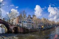 AMSTERDAM, NETHERLANDS, MARCH, 10 2018: Beautiful outdoor view Amsterdam canals with bridge and typical dutch houses