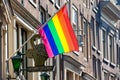 Bet van Beeren CafÃÂ© `t Mandje and the LGBT flag at the Old Central district in Amsterdam Royalty Free Stock Photo