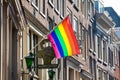 Bet van Beeren CafÃÂ© `t Mandje and the LGBT flag at the Old Central district in Amsterdam Royalty Free Stock Photo