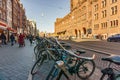 AMSTERDAM, NETHERLANDS - March 20, 2018 : Bicycles on the street of Amsterdam at sunny spring day. Royalty Free Stock Photo
