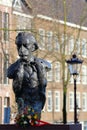 Close-up on the statue of Dutch writer Multatuli on the Torensluis bridge along Singel Canal