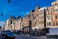 The Damrak avenue at the Old Central district in Amsterdam