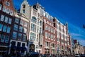 The Damrak avenue at the Old Central district in Amsterdam