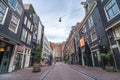 Amsterdam, Netherlands - 2020 March 18 : Empty Amsterdam downtown streets without people, closed restaurants and stores