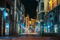 Amsterdam, Netherlands - March 18, 2020 : Empty shopping street without people with closed stores in evening in Royalty Free Stock Photo
