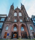 Amsterdam, Netherlands - March 2020 : Facade of De Krijtberg Kerk is Roman Catholic church in Amsterdam, located at