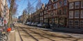 AMSTERDAM, NETHERLANDS - March 20, 2018 : narrow streets of Amsterdam at sunny spring day. Royalty Free Stock Photo