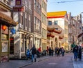 AMSTERDAM, NETHERLANDS - March 20, 2018 : narrow streets of chinatown in Amsterdam at sunny spring day. Royalty Free Stock Photo