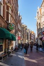 AMSTERDAM, NETHERLANDS - March 20, 2018 : narrow streets of Amsterdam at sunny spring day. Royalty Free Stock Photo