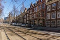 AMSTERDAM, NETHERLANDS - March 20, 2018 : narrow streets of Amsterdam at sunny spring day. Royalty Free Stock Photo