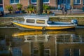 AMSTERDAM, NETHERLANDS, MARCH, 10 2018: Outdoor view of boat in the canals of Amsterdam. Amsterdam is the capital and