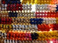 Amsterdam, Netherlands - March 12 2012: Rows of colorful clogs hanging in the store, Dutch wooden shoes, klompen Royalty Free Stock Photo