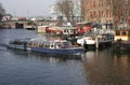 AMSTERDAM,NETHERLANDS-MARCH 8:Tourists enjoying sightseeing with Gray line tour boat Royalty Free Stock Photo