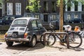 Amsterdam, Netherlands - May 21, 2018: Back of the black old rusty Italian small car Fiat 500L or Lusso parked at one