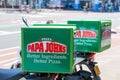 Amsterdam, Netherlands - May, 2018: A close-up of the Papa Johns Pizza logo on delivery bicycles outdoors. Papa John`s Pizza is a