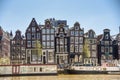 Amsterdam, Netherlands, May 2022. The dancing houses and the house boats at the Amstel river in Amsterdam Royalty Free Stock Photo
