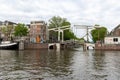 Amsterdam, The Netherlands - May 16, 2022: drawbridge on a canal in the city of Amsterdam