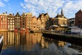 Exterior view of buildings at Damrak street in the old town part Royalty Free Stock Photo