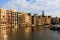 Exterior view of buildings at Damrak street in the old town part Royalty Free Stock Photo