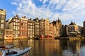 Exterior view of buildings at Damrak street in the old town part Royalty Free Stock Photo