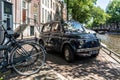 Front of the black old rusty Italian small car Fiat 500 Giardiniera