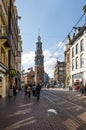 Amsterdam, Netherlands - May 8, 2015: People at The Munttoren (Mint Tower) Muntplein square in Amsterdam Royalty Free Stock Photo