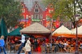 Amsterdam, The Netherlands May. Tourists and locals drinking and eating at the Rembrandtplein square with old colorful