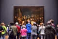 Amsterdam, Netherlands - May 6, 2015: Visitors at the famous painting Night watch at Rijksmuseum