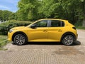 Yellow Peugeot 208