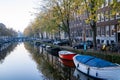 Buildings and house boats along canal during an early autumn fall morning in the Royalty Free Stock Photo