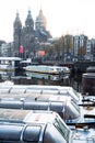 Amsterdam, Netherlands - November 9, 2019: Buildings and house boats along Signel canal during an early autumn sunrise morning in Royalty Free Stock Photo