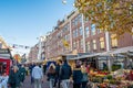 People visiting the Albert Cuyp Market, a street market and tourist attraction in Amsterdam, the Netherlands Royalty Free Stock Photo