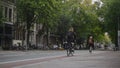 AMSTERDAM, NETHERLANDS - 18 oct 2016, tourists on the street, bicycle and cars - tram rides through the historic center