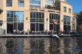 Hard rock cafe exterior with people sitting at terrace Royalty Free Stock Photo