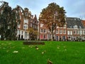 Amsterdam / The Netherlands - October 30 2016: Old yard Begijnhof with houses and garden