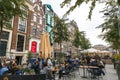 People eating, drinking and gathering in the vibrant cafes, pubs and restaurants of Amsterdam Royalty Free Stock Photo