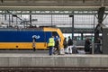 Passengers getting directions on a railway platform