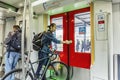 Amsterdam, Netherlands, 10/12/2019: People in a subway car. A man with a bicycle goes to the station Royalty Free Stock Photo