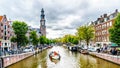 The Westerkerk church with the Westertoren tower seen from the Prinsengracht canals in the Jordaan neighborhood of Amsterdam