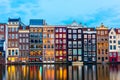 Sunset view of Amsterdam cityscape with canal, bridge and typical Dutch Houses. Amsterdam, Netherlands Royalty Free Stock Photo