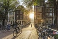 Amsterdam, Netherlands - September 22, 2021: Amsterdam at Early morning. Artistic image. People ride bicycles, the ancient