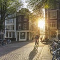 Amsterdam, Netherlands - September 22, 2021:  Early morning in Amsterdam.  People ride bicycles, the ancient European city of Royalty Free Stock Photo