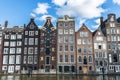 Old traditional leaning houses along the canal in Amsterdam, Netherlands