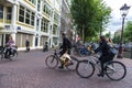 Street with people on bicycle in Amsterdam, Netherlands