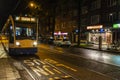 Tram circulating at night in Amsterdam, Netherlands