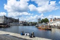 Young people on a pier of a canal in Amsterdam, Netherlands Royalty Free Stock Photo