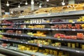 Amsterdam, Netherlands, 10/10/2019: Served fruits on shelves in a store. Large selection of natural healthy snacks. Vitamins and